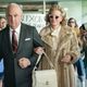 Sean Penn as John Mitchell and Julia Roberts as Martha Mitchell